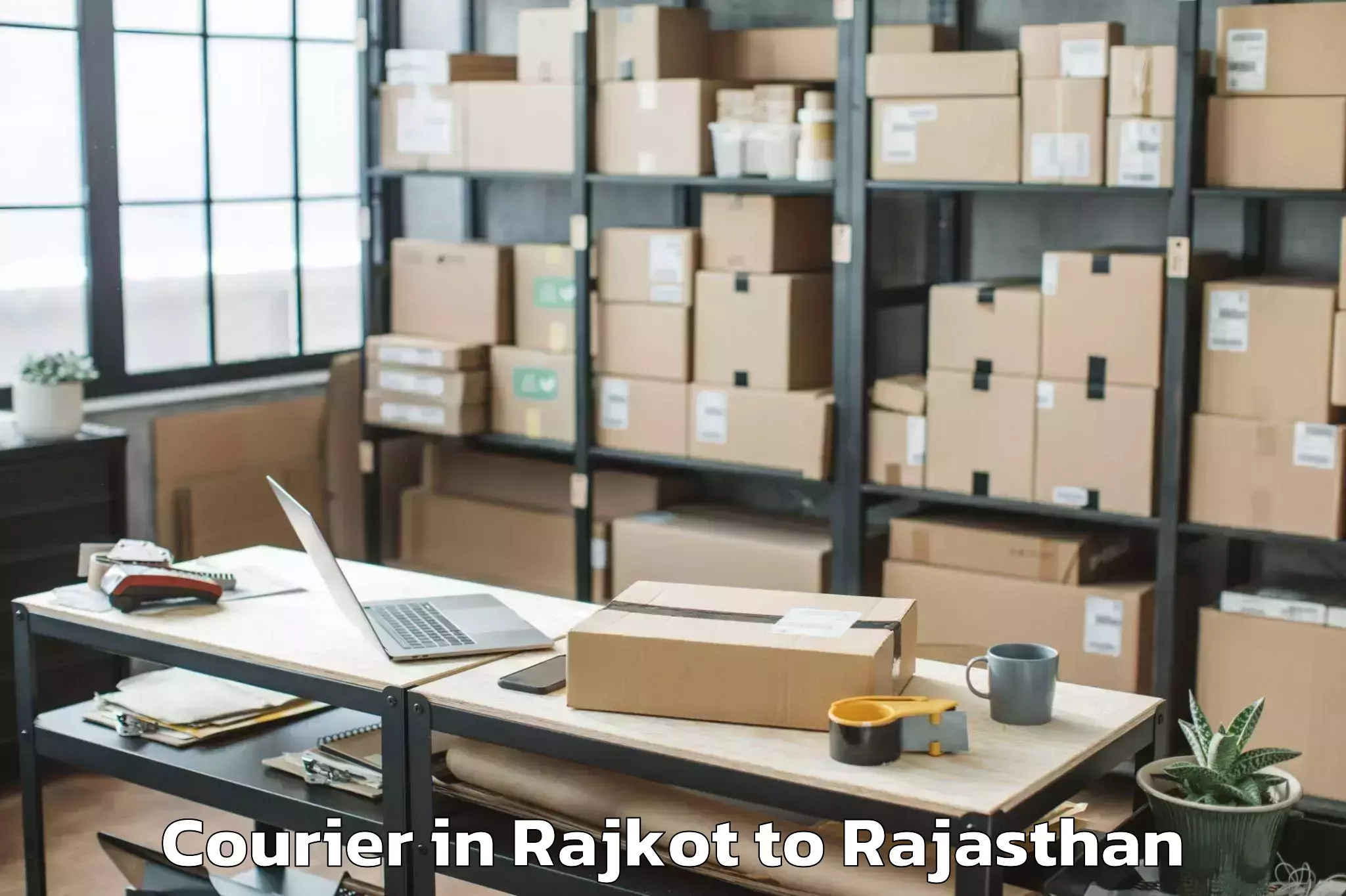 Reliable Rajkot to Opjs University Churu Courier